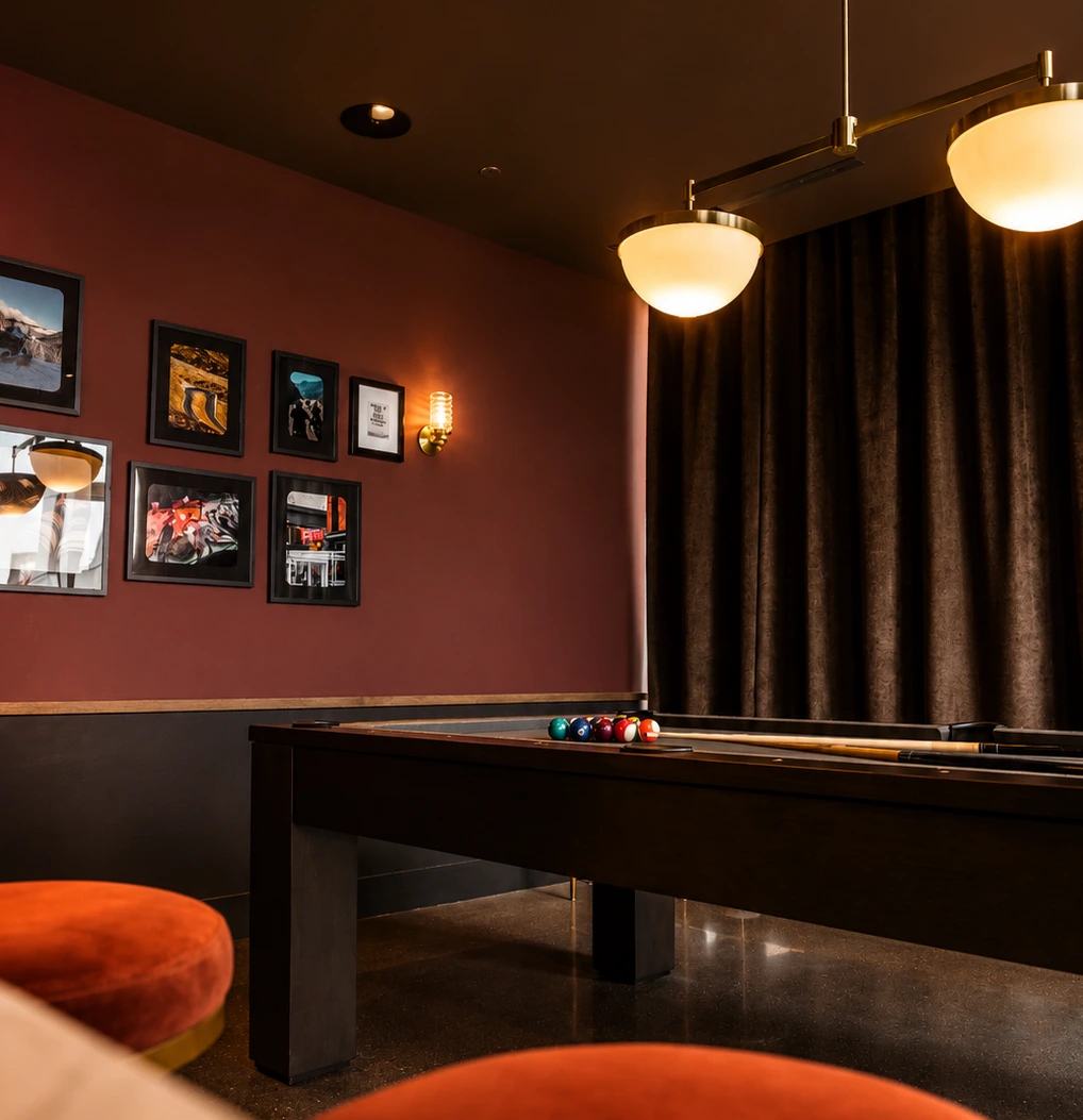 Billiard room at Stead 220 with pool table, lounge seating, and framed wall art